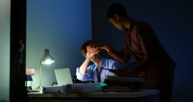 Overworked Businessman Being Comforted by Colleague at Night in Office - Download Free Stock Images Pikwizard.com