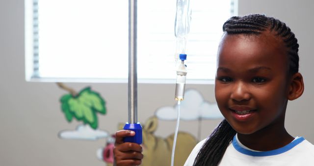 Smiling Girl Receiving Intravenous Therapy in Hospital Setting - Download Free Stock Images Pikwizard.com