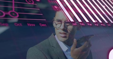 Executive speaking into smartphone with magenta data overlay and monthly bar charts for analytics