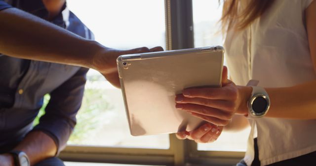 Business Team Collaborating Using Tablet Near Window - Download Free Stock Images Pikwizard.com