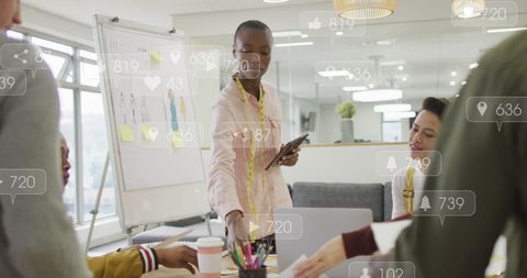 Diverse fashion designers engaging in collaborative discussion