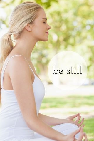 Serene woman meditating outdoors for mindfulness and calm