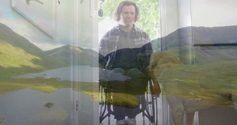 Wheelchair user at doorway with golden retriever and scenic overlay