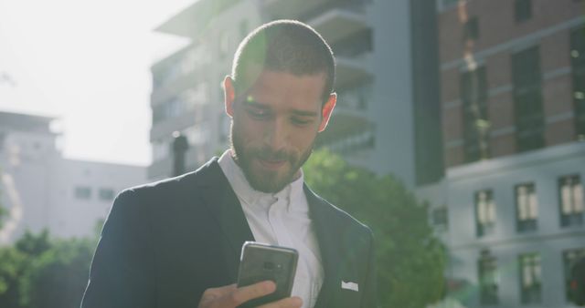 Smiling Man in Suit Using Smartphone in Urban Setting - Download Free Stock Images Pikwizard.com