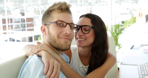 Office Romance: Happy Businesswoman Embracing Colleague