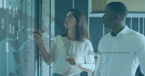 Diverse Team Analyzing Global Data Interface in Office