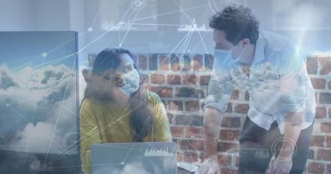 Colleagues in Masks Collaborating in Tech-Driven Workspace