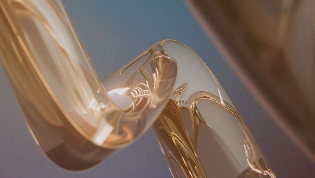 Abstract twisting gold tubes with reflective surface