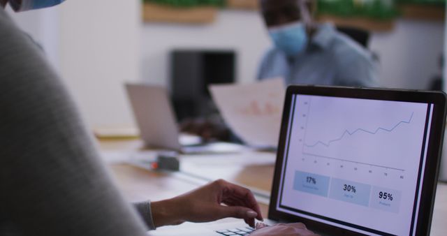 Business People Analyzing Growth Data on Laptop in Office with Face Masks - Download Free Stock Images Pikwizard.com