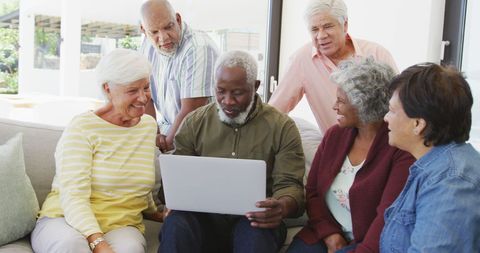 Diverse Senior Group Engaging in Technology Discussion - Download Free Stock Images Pikwizard.com