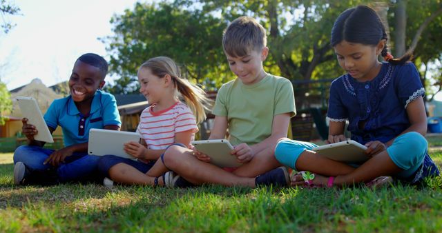 Diverse Group of Children Using Tablets in Park - Download Free Stock Images Pikwizard.com