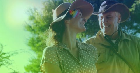 Joyful Couple Relaxing Outdoors in Summer Sun
