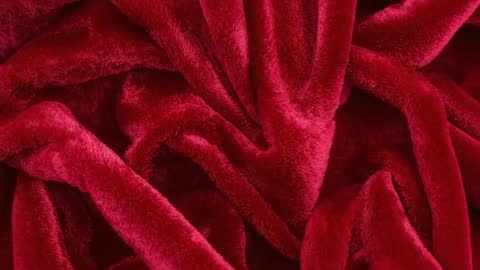 Red Plush Velvet Blanket Shifting into V-Fold Closeup Loop Showing Rich Burgundy Pile Texture