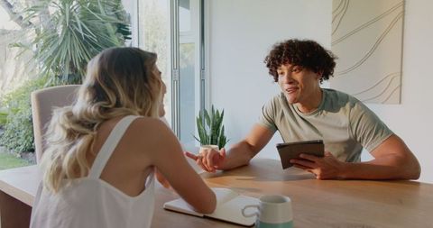 Couple Planning Future Together Using Tablet at Home