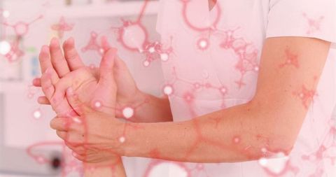 Therapist Providing Wrist Treatment with Molecular Graphics Overlay