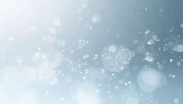 Ethereal blue-gray bokeh particles drifting over soft gradient glow background
