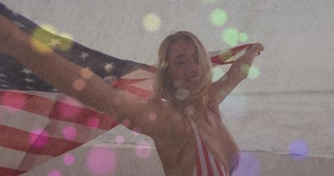 Woman Celebrating Freedom at Beach with American Flag