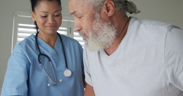 Nurse Assisting Elderly Man with Mobility - Download Free Stock Images Pikwizard.com