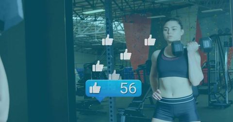 Woman lifting dumbbell in gym mirror with floating social likes overlay