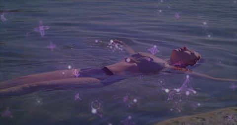 Floating in Tranquil Waters with Ethereal Geometric Patterns