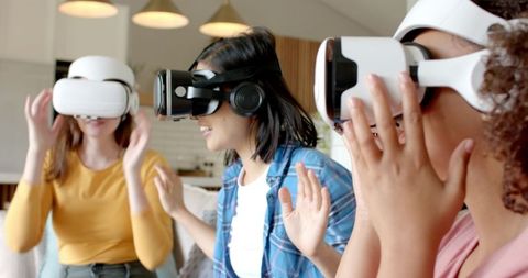 Diverse Women Engaging with VR Technology at Home