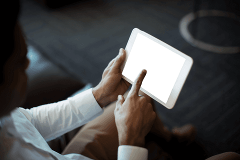 Businessman seamlessly navigating tablet work device transparent screen