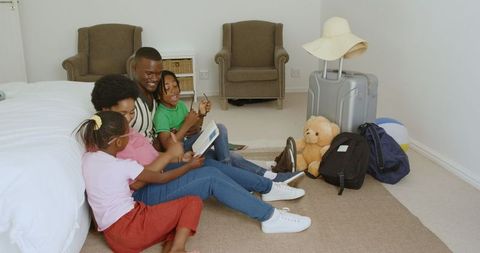 Young Family Preparing for Vacation at Home