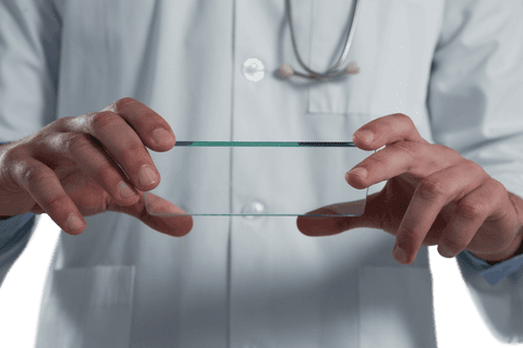 Doctor Holding Transparent Mobile Touchscreen Device - Download Free Stock Videos Pikwizard.com