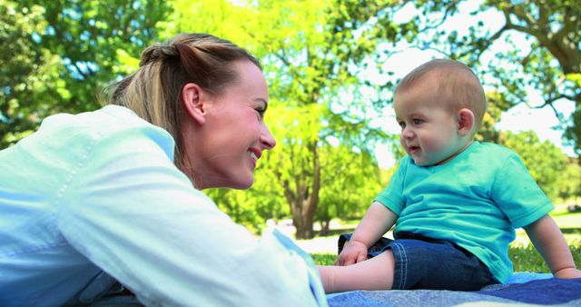 Mother Bonding with Baby on Picnic Blanket in Park - Download Free Stock Images Pikwizard.com