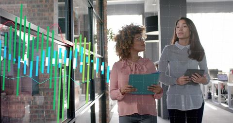 Businesswoman Collaborating in Modern Office with Data Graphics