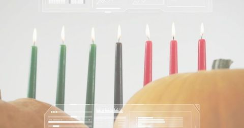 Kwanzaa kinara seven lit candles with pumpkins minimalist autumn still life