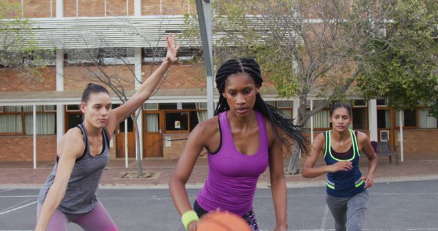 Women Playing Basketball Outdoors in Focused and Competitive Game - Download Free Stock Images Pikwizard.com