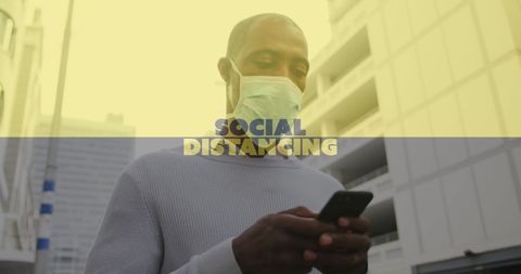 Man in Mask Using Smartphone with Social Distancing Text Overlay
