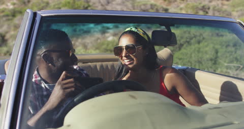 Smiling Couple on Scenic Convertible Road Trip