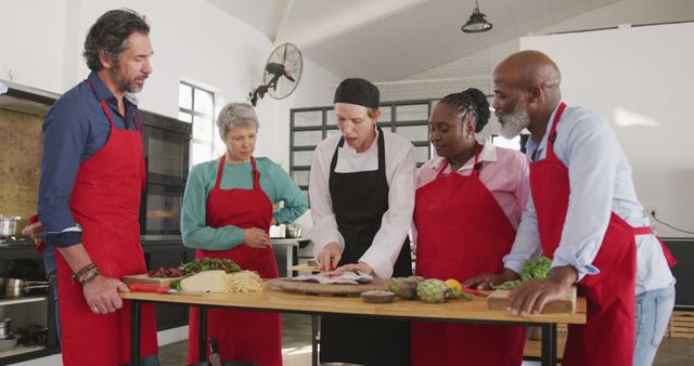 Diverse Group of Adults Learning Cooking Together in Kitchen - Download Free Stock Images Pikwizard.com