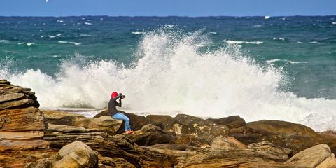 Brave Photographer Capturing Majestic Ocean Waves