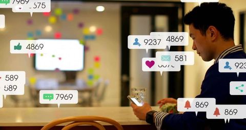 Focused professional checking smartphone amid social notifications at modern office bar