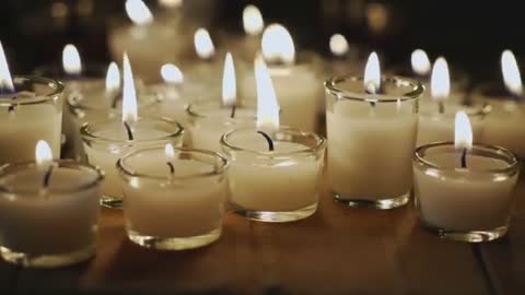 Votive Candles Flickering on Wooden Table Creating Warm Bokeh Ambience | Relaxation Video Loop
