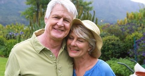 Elderly Couple Enjoying Sunny Day in Garden