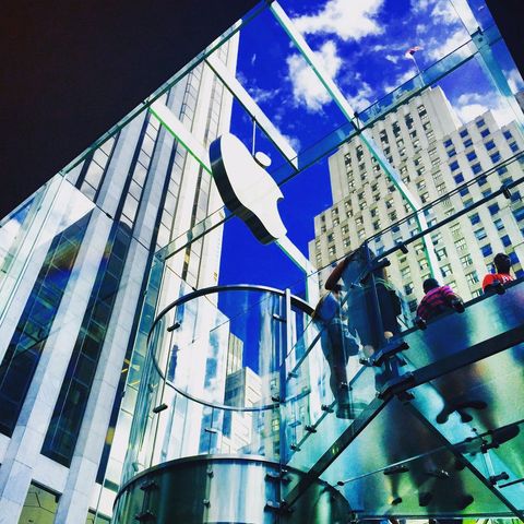 Modern glass building with apple logo