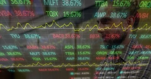 Analyst reviewing stock data on futuristic display