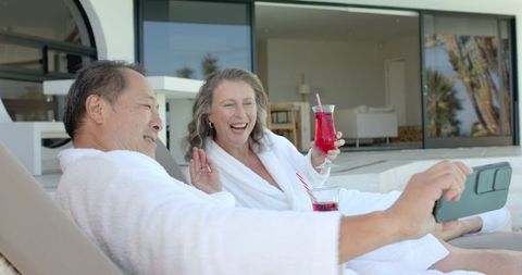 Senior Couple Enjoying Relaxing Outdoors Selfie Moment
