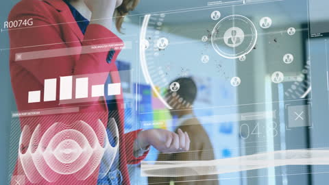 Businesswoman Analyzing Virtual Data Interfaces in Office