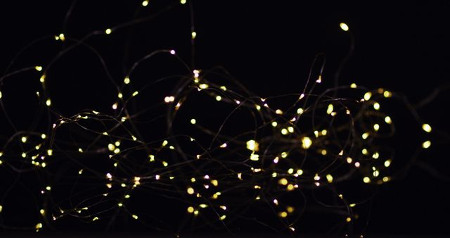 Golden Fairy Lights Floating on Black Background for Celebration - Download Free Stock Images Pikwizard.com