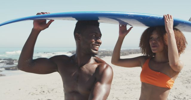 Happy Couple Holding Surfboard on the Beach - Download Free Stock Images Pikwizard.com