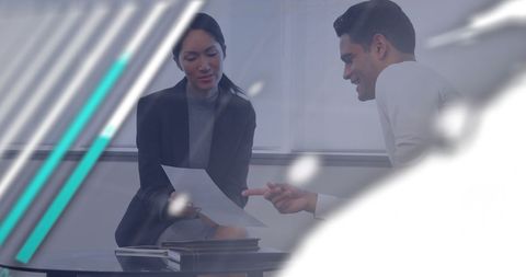 Cooperative team reviewing financial documents in modern office