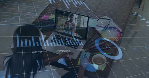 Designer Engaged in Virtual Meeting Amid Financial Analytics Overlay