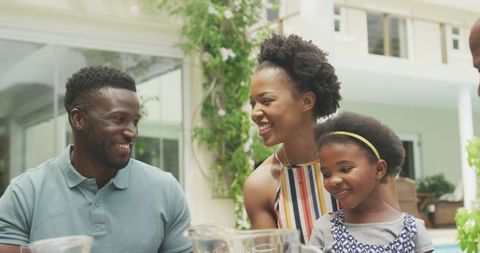 Happy African American Family Enjoying Breakfast Outdoors