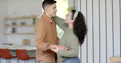 Romantic Couple Dancing in Contemporary Home Kitchen