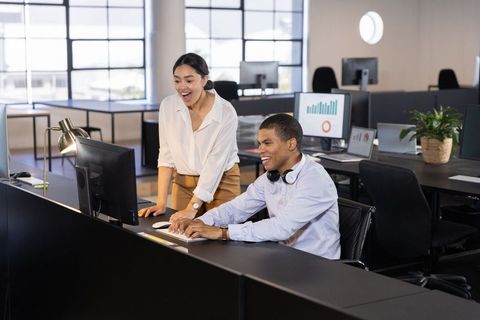Diverse Team Collaborating in Modern Open Office Environment
